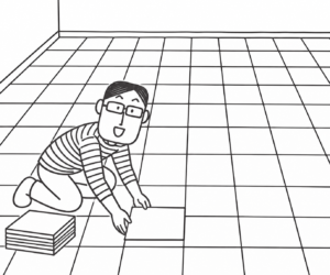 広い床にタイルをぴっしり敷く人物