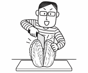 キャベツを切る人物